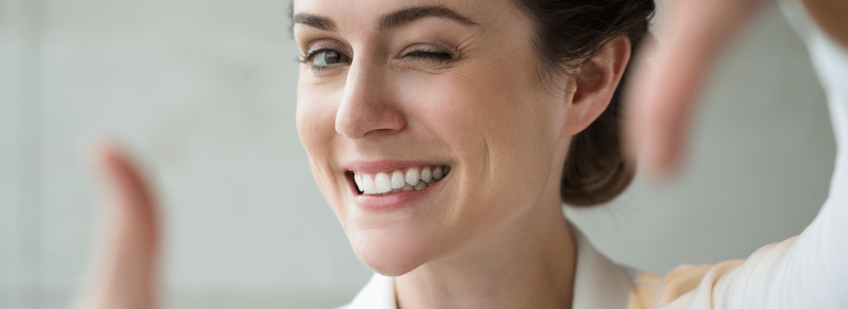 closeup-smiling-woman-making-frame-gesture
